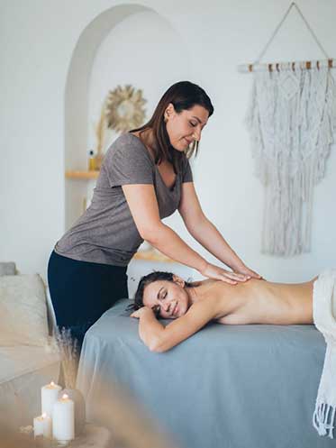 Woman receiving massage and relaxing