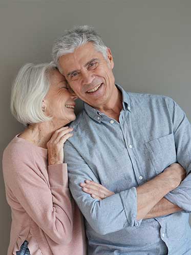 Happy couple symbolizing balanced hormones and restored energy through every life stage.