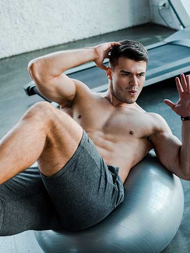 Mature man strength training and stretching in natural light—showing strength, balance, and longevity lifestyle.